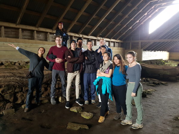 Students on study abroad in Iceland exploring a viking settlers longhouse in Iceland
