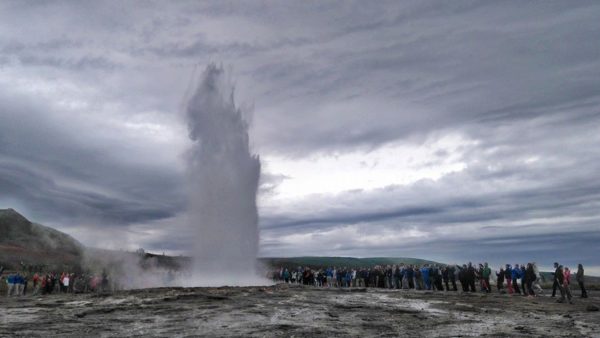 Geysir hot spring with a Golden Circle with a local