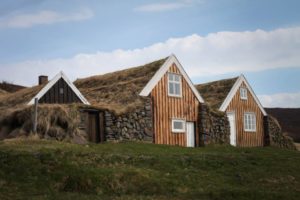 Students on study abroad in Iceland visiting a replica turf house in Iceland
