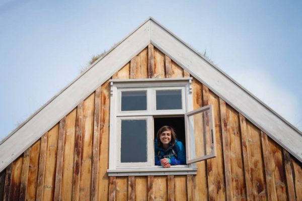 Students on study abroad in Iceland exploring a turfhouse in Iceland